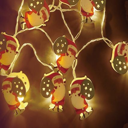Aigostar - Catena luminosa LED, 10 LED, alimentazione 3×AA, 1,5 m, bianco caldo, motivo Babbo Natale