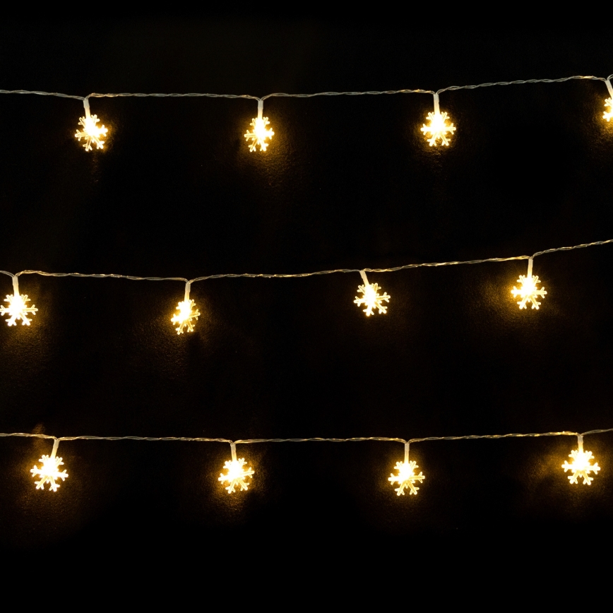 Aigostar - Catena luminosa LED per Natale 10xLED/3xAA 1,5m bianco caldo fiocchi di neve