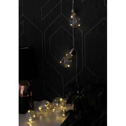 Catena luminosa decorativa a LED SMOLDER, 2,1 m — 10 LED, alimentata da 2 batterie AA