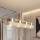 Lampadario a sospensione con cavo LUX 4xE27/15W/230V bianco/oro