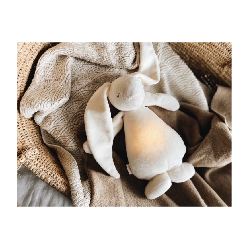 Moonie - Compagno di coccole con melodia e luce coniglietto powder