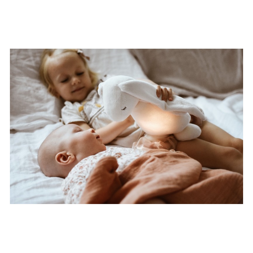 Moonie - Compagno di coccole con melodia e luce coniglietto powder