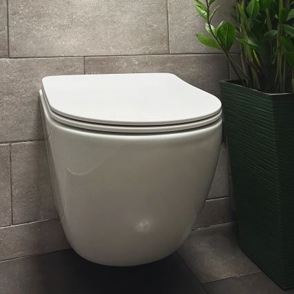 REA-C1259 - WC sospeso con sedile CARLO MINI TORNADO RIMLESS in ceramica/bianco lucido